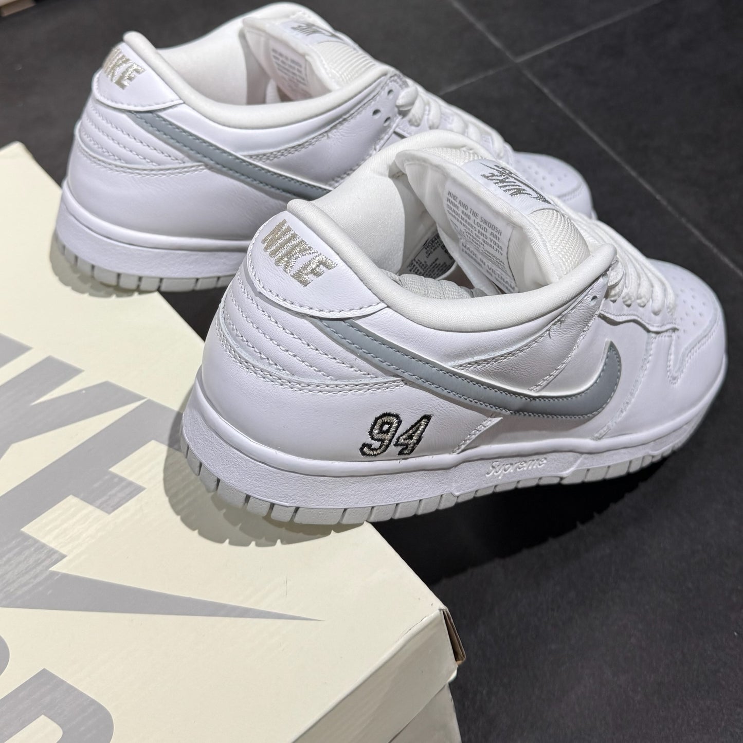 Nike SB Dunk Low x Supreme 94 - White Metallic Silver