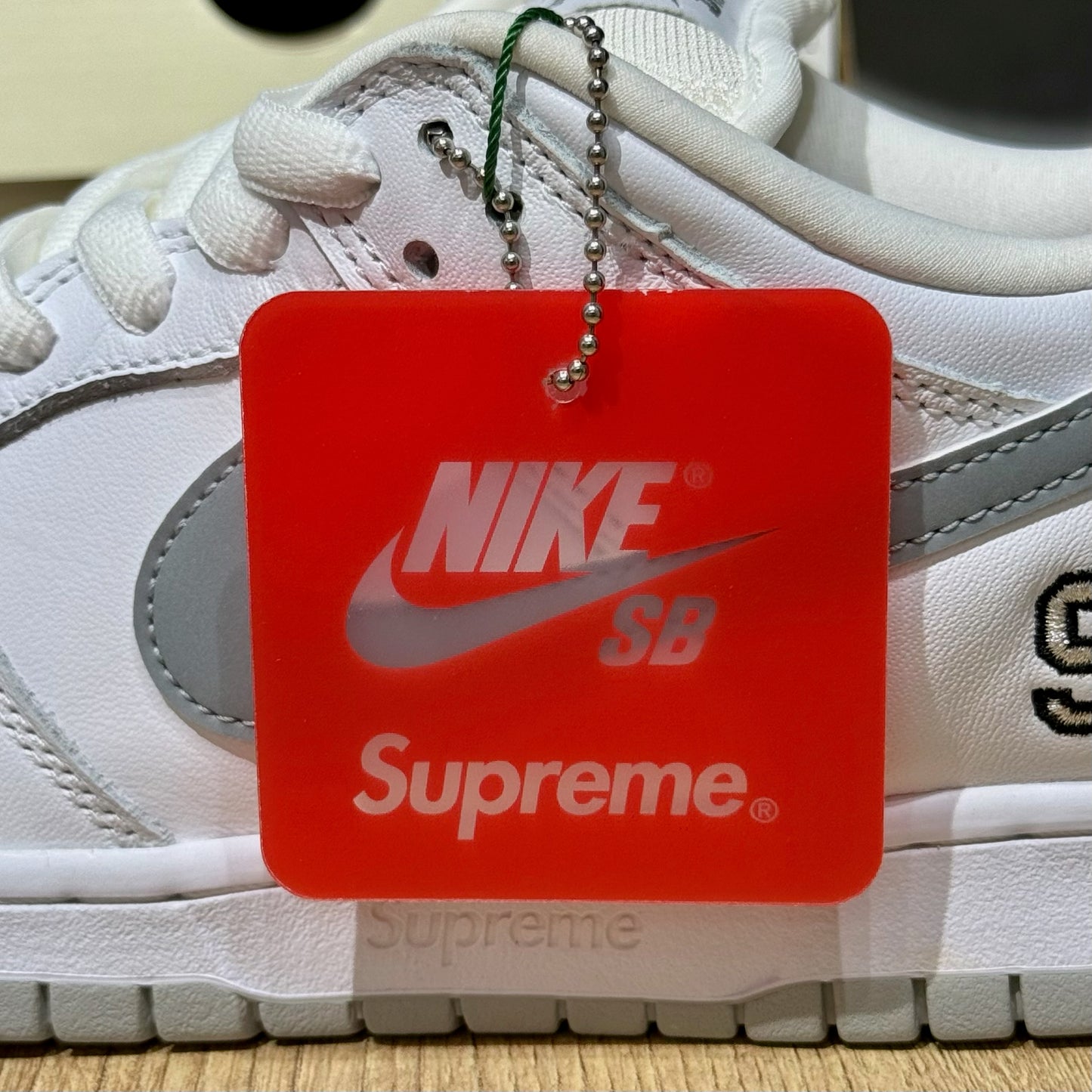 Nike SB Dunk Low x Supreme 94 - White Metallic Silver