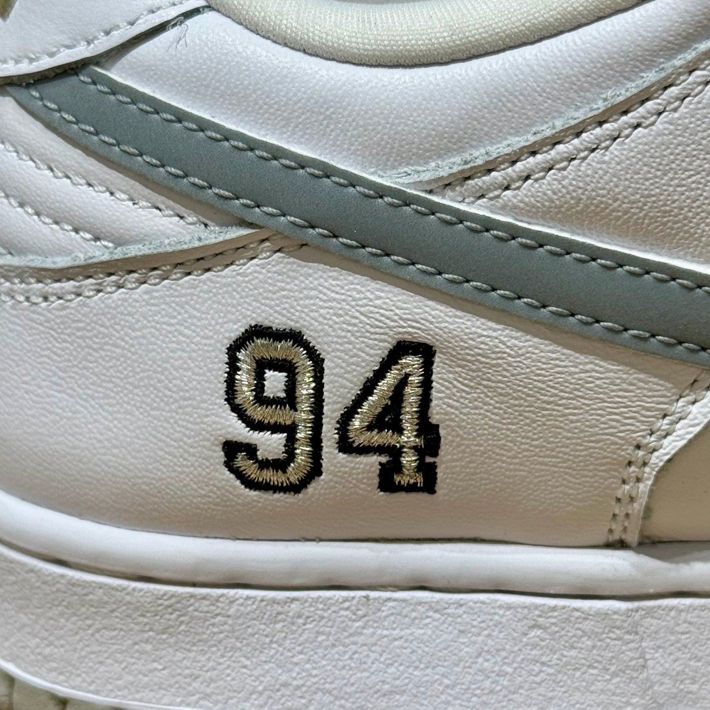 Nike SB Dunk Low x Supreme 94 - White Metallic Silver