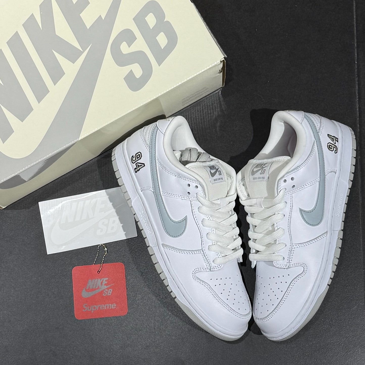 Nike SB Dunk Low x Supreme 94 - White Metallic Silver
